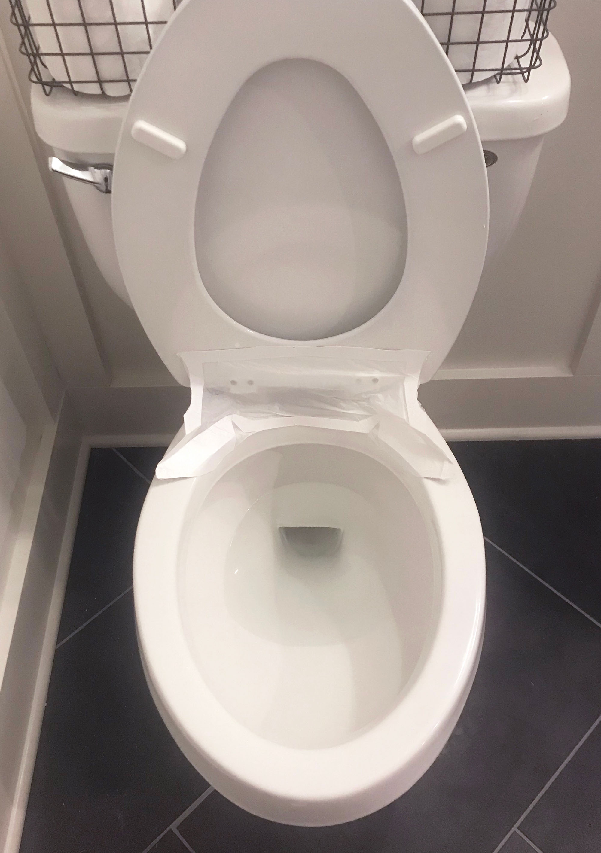Guardian Angel toilet splash shield installed beneath toilet seat